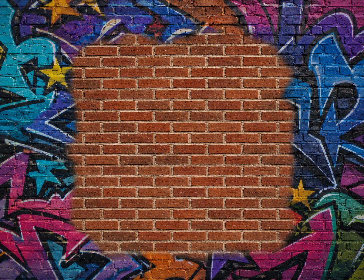 Brick wall with graffiti before laser cleaning